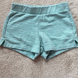 I’m selling a teal pair of shorts medium size 8 with white pattern